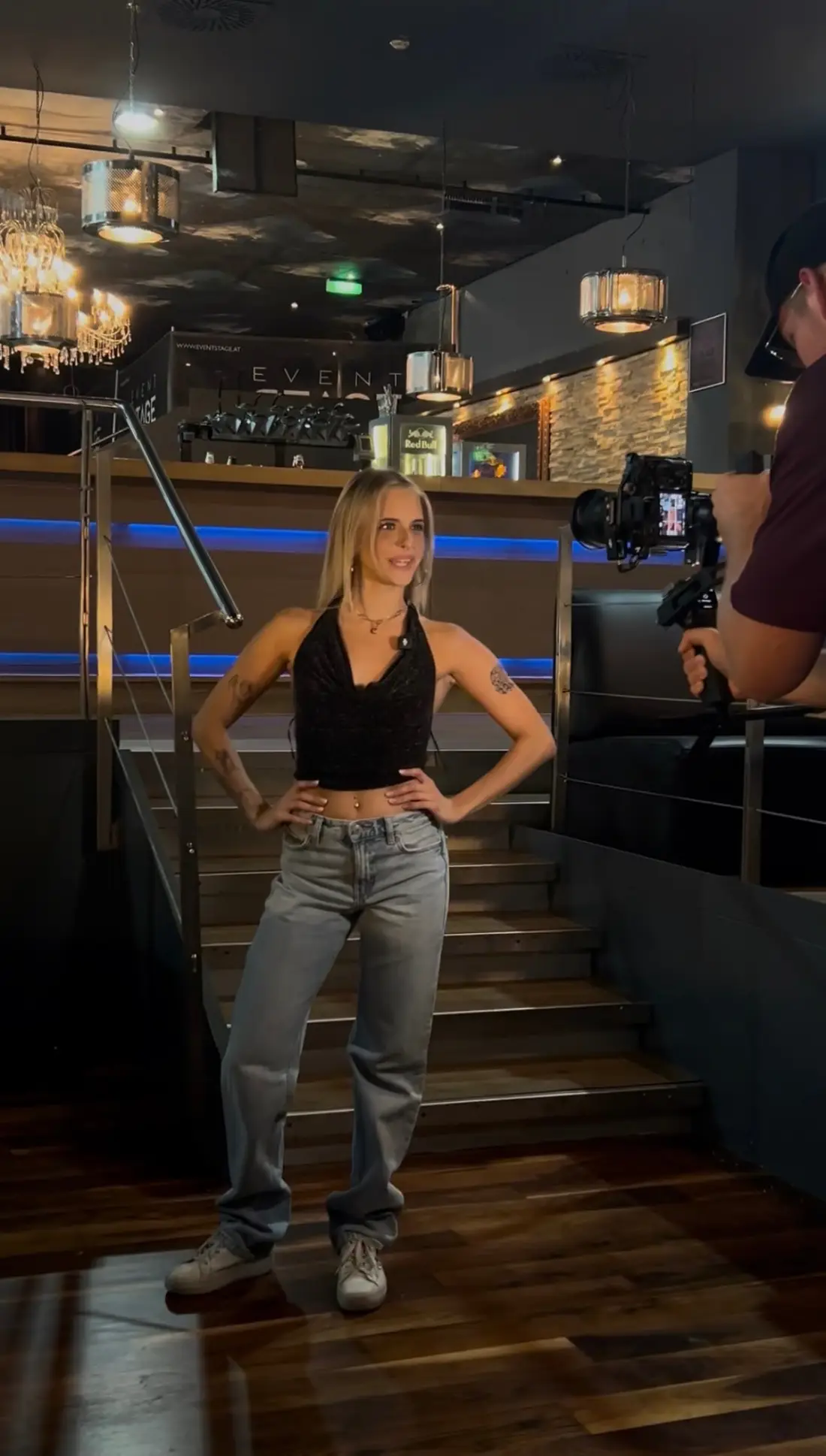 Shooting a promo reel at Eventstage: performer on the stairs, camera operator with gimbal on the right