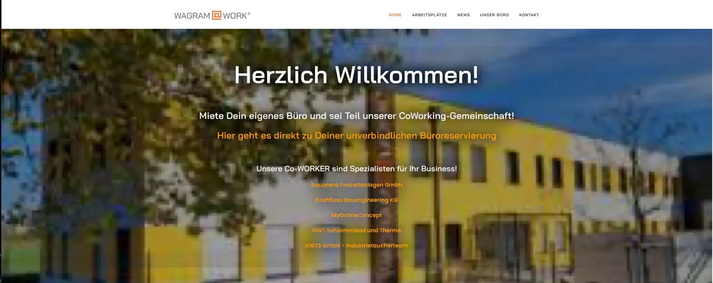 Old Wagram@Work home page with a blurry photo of the building and the heading Herzlich Willkommen