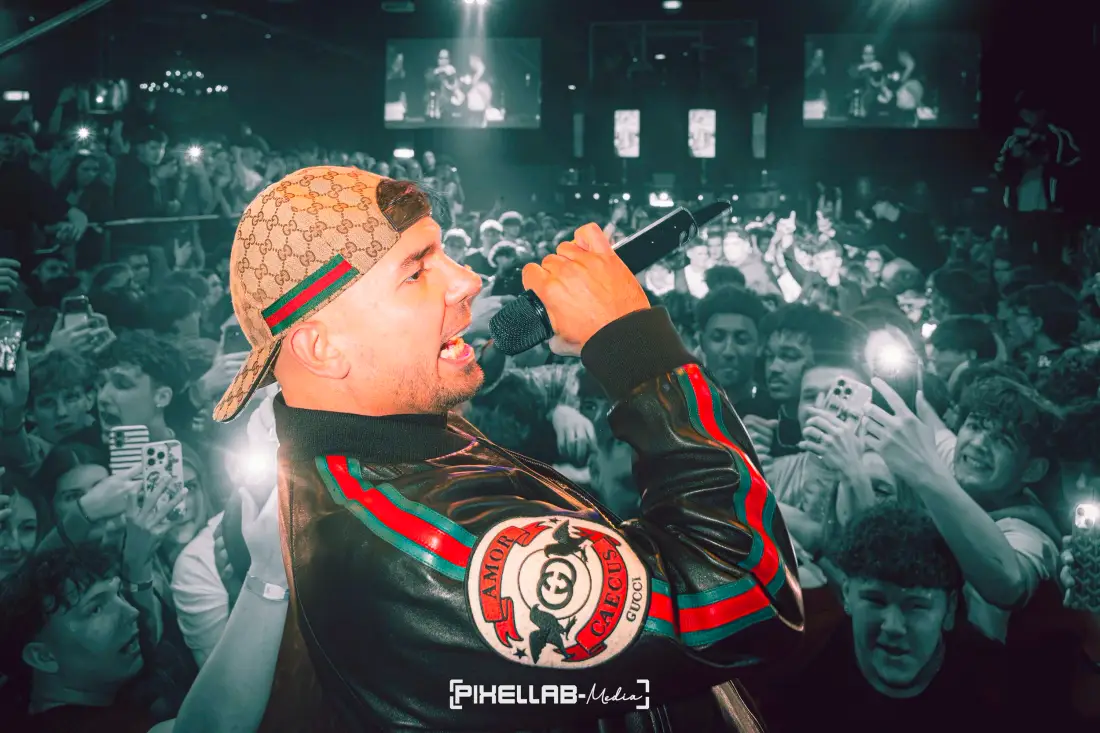 Rapper with a microphone in front of an audience
